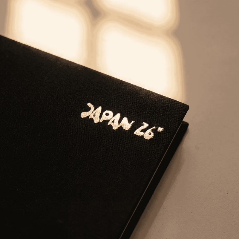 Customer text mark — top-right of the cover, foil-stamped