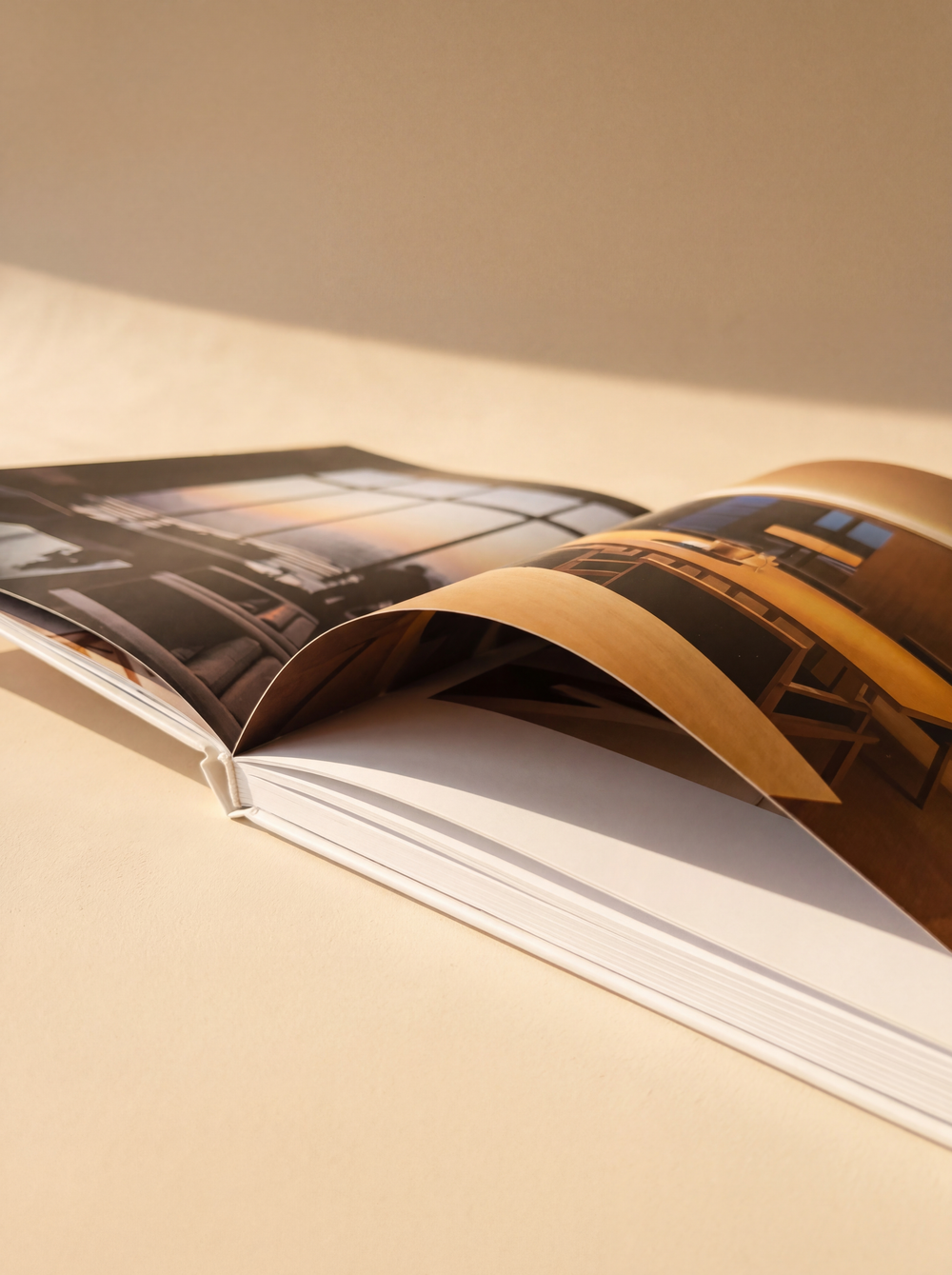 Archival 200gsm matte paper page spread — photograph-grade paper that preserves color for fifty years
